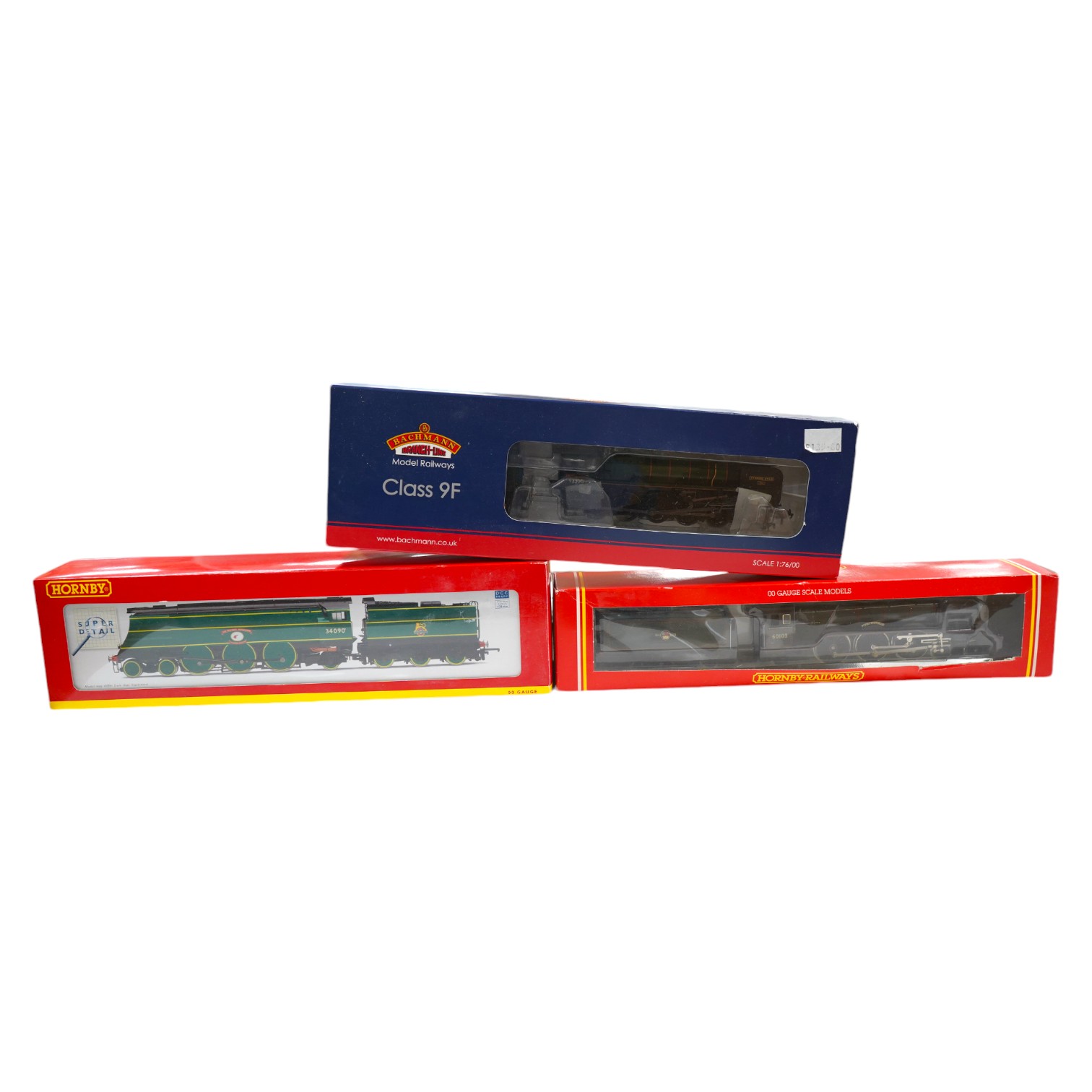 Three boxed Hornby and Bachmann 00 gauge railway BR locomotives; a Class 9F (32-850A), a Battle of Britain Class (R2692), and a Class A3 (R078). Condition - good.